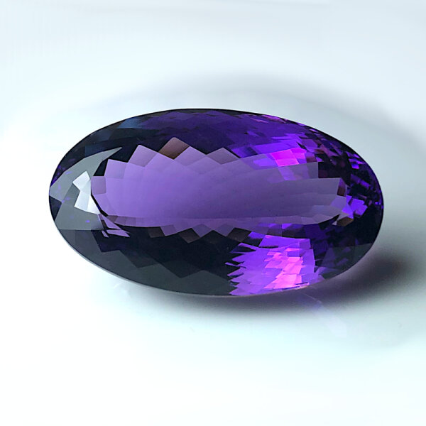 Amethyst dark violet oval cut 67.3 Carats 34.1x20.1mm untreated natural
