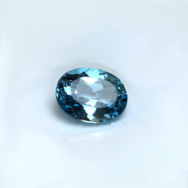 Swiss Blue Topaz oval cut 12 Carats min. 16x12mm treated natural